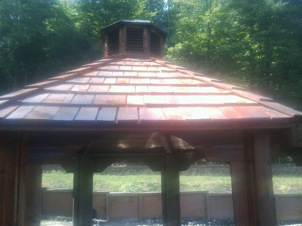 New cedar shake roof and cupola on a lakeside gazebo in Rahway